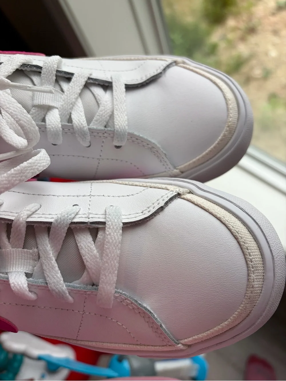 Nike White Sneakers with Pink Swoosh and Accent Stripe